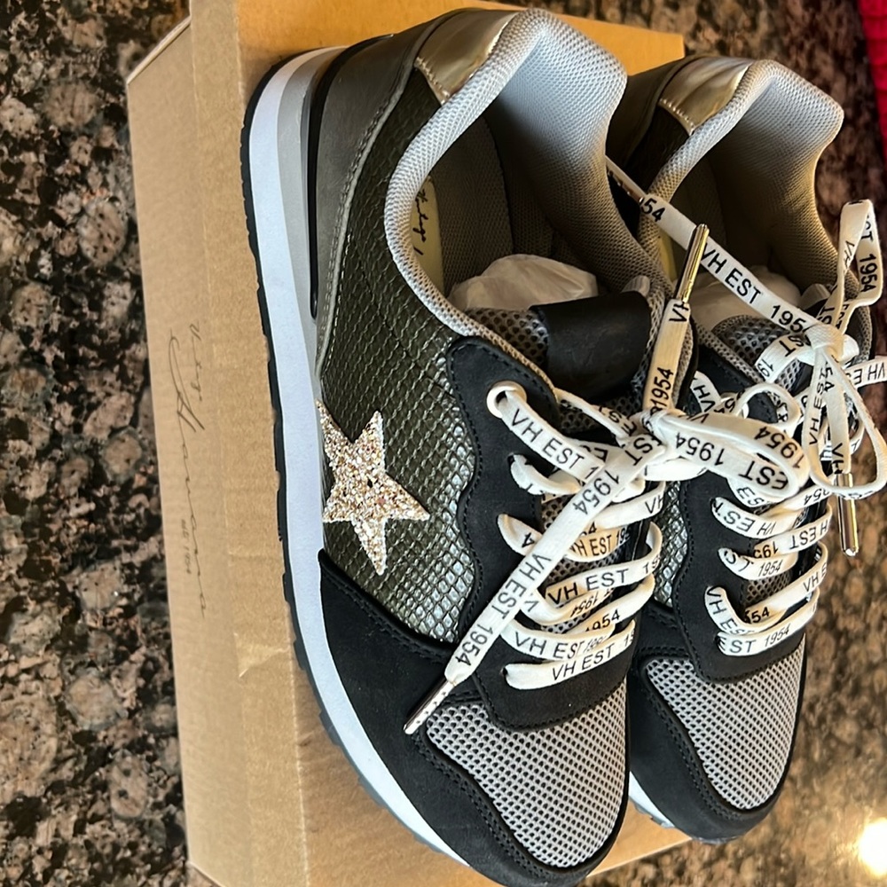 New in box, never worn Vintage Havana Felice size 8 color black camo mix.
